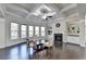 Living room featuring large windows, a fireplace with built-in shelving and coffered ceilings at 3608 Crayton Glen Way, Buford, GA 30519