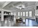 Open-concept living room with coffered ceiling, fireplace, and eat-in kitchen at 3608 Crayton Glen Way, Buford, GA 30519