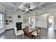 Spacious living room featuring a cozy fireplace with built-in shelving and coffered ceilings at 3608 Crayton Glen Way, Buford, GA 30519