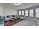 Bright living room features large windows, plush seating, and a stylish rug at 3608 Crayton Glen Way, Buford, GA 30519