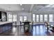 Open-concept living room features a seating area, a fireplace, and lots of natural light at 3608 Crayton Glen Way, Buford, GA 30519