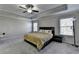 Spacious main bedroom with ceiling fan, side tables, and natural light at 3608 Crayton Glen Way, Buford, GA 30519