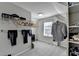 A walk-in closet features custom shelving and ample storage space, bathed in natural light from the window at 3608 Crayton Glen Way, Buford, GA 30519