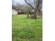 Expansive back yard with mature trees and green space at 304 Deerfield Dr, Jonesboro, GA 30238