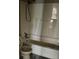 This bathroom features a shower-tub combo and tile flooring at 304 Deerfield Dr, Jonesboro, GA 30238
