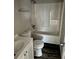 Standard bathroom with white tub/shower combo, sink and toilet at 304 Deerfield Dr, Jonesboro, GA 30238