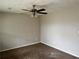 This bedroom features neutral walls, carpet and ceiling fan at 304 Deerfield Dr, Jonesboro, GA 30238