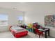 Bedroom with a car-shaped bed and a desk with colorful decor at 4205 Madison Hall Dr, Cumming, GA 30028