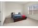 Bedroom with a blue bed and a window with blinds at 4205 Madison Hall Dr, Cumming, GA 30028