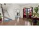 This foyer boasts hardwood floors, a staircase and an office at 4205 Madison Hall Dr, Cumming, GA 30028