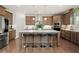 Spacious kitchen featuring stainless steel appliances, a large island, and ample cabinet space at 4205 Madison Hall Dr, Cumming, GA 30028