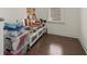 This clean storage room features hardwood floors and a view to the window at 4205 Madison Hall Dr, Cumming, GA 30028