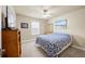 Bedroom with carpeted floors, a ceiling fan, and a window with natural light at 540 Roland Manor Dr, Dacula, GA 30019