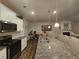 Modern kitchen with granite countertops, stainless steel appliances, and an open layout at 623 Wayland Ct, Fairburn, GA 30213