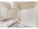 Bathroom featuring white fixtures including a vanity, toilet, and shower-tub combo at 2370 Wingfoot Pl, Decatur, GA 30035