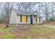 Charming home featuring a gray exterior, black shutters and a well-maintained lawn at 2370 Wingfoot Pl, Decatur, GA 30035