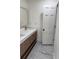 Bathroom with modern features including a double sink vanity, and a marble tile floor at 2899 Tejas Sw Trl, Atlanta, GA 30331
