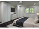 Stylishly decorated bedroom with hardwood floors, built-in storage, and a plush bed at 2899 Tejas Sw Trl, Atlanta, GA 30331
