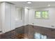 Bright bedroom features hardwood floors, a window, and built-in storage cabinets and drawers at 2899 Tejas Sw Trl, Atlanta, GA 30331
