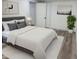 Stylish bedroom featuring a bed with decorative pillows, complemented by modern decor and ample natural light at 2899 Tejas Sw Trl, Atlanta, GA 30331