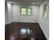 A bedroom offers natural light, hardwood flooring and built in cabinets and drawers at 2899 Tejas Sw Trl, Atlanta, GA 30331