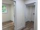 Bright hallway features new wood floors, white walls, and white trim for a modern, clean look at 2899 Tejas Sw Trl, Atlanta, GA 30331