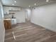 Well-lit kitchenette area boasting modern cabinets and a sink, complemented by sleek, updated flooring at 2899 Tejas Sw Trl, Atlanta, GA 30331