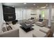 Inviting living room with a black brick fireplace, plush seating, and neutral decor at 2899 Tejas Sw Trl, Atlanta, GA 30331