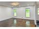 Spacious living room featuring hardwood floors, recessed lighting, and large windows at 2899 Tejas Sw Trl, Atlanta, GA 30331