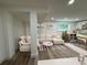 Cozy living room showcasing a comfortable sectional sofa and an adjacent kitchenette, perfect for relaxation and entertaining at 2899 Tejas Sw Trl, Atlanta, GA 30331