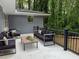 Outdoor patio features neutral furniture and a view of the surrounding, lush greenery at 2899 Tejas Sw Trl, Atlanta, GA 30331