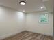 Neutral room with fresh paint, updated flooring, and a window providing natural light, ideal for a bedroom or office at 2899 Tejas Sw Trl, Atlanta, GA 30331