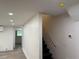 Modern stairwell featuring recessed lighting, neutral walls, and updated trim and flooring, offering a fresh, clean look at 2899 Tejas Sw Trl, Atlanta, GA 30331