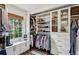 Organized walk-in closet with custom shelving, drawers, and natural light for optimal storage and convenience at 3372 Pine Meadow Nw Rd, Atlanta, GA 30327