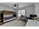Bedroom featuring a bunk bed, work space, and ceiling fan at 161 Muddy River Rd, Lawrenceville, GA 30043