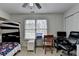 Bedroom features a bunk bed, work space, and ceiling fan at 161 Muddy River Rd, Lawrenceville, GA 30043