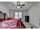 Bedroom featuring a decorative bed and a large window that provides plenty of natural light at 161 Muddy River Rd, Lawrenceville, GA 30043