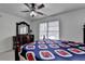 Bedroom featuring a window, dresser and queen size bed at 161 Muddy River Rd, Lawrenceville, GA 30043