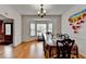 The dining room features hardwood flooring, a bay window, and a chandelier at 161 Muddy River Rd, Lawrenceville, GA 30043