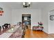 Dining area with hardwood floors, seamlessly transitions into the kitchen, ideal for entertaining at 161 Muddy River Rd, Lawrenceville, GA 30043