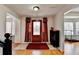 Home's foyer has hardwood flooring, a decorative front door, and a convenient shoe rack at 161 Muddy River Rd, Lawrenceville, GA 30043