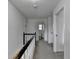 Upstairs hallway with railing at 161 Muddy River Rd, Lawrenceville, GA 30043