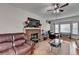 Cozy living room features a brick fireplace and lots of natural light at 161 Muddy River Rd, Lawrenceville, GA 30043