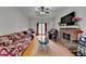 Bright living room with hardwood floors, fireplace, and lots of seating at 161 Muddy River Rd, Lawrenceville, GA 30043