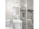 Bright bathroom featuring a vanity, toilet, and tiled shower with glass door at 2923 Hall Se Dr, Smyrna, GA 30082