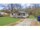 Well-maintained single-story home with a spacious front yard and traditional design elements at 2923 Hall Se Dr, Smyrna, GA 30082