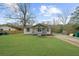 Well-maintained single-story home with a spacious front yard and traditional design elements at 2923 Hall Se Dr, Smyrna, GA 30082