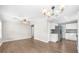 Spacious living room with neutral walls, wood floors, and views into the modern kitchen at 2923 Hall Se Dr, Smyrna, GA 30082