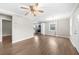 Spacious living room with hardwood floors that flows into a modern eat-in kitchen at 2923 Hall Se Dr, Smyrna, GA 30082