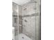 Modern shower with glass door and tiled walls at 2923 Hall Se Dr, Smyrna, GA 30082